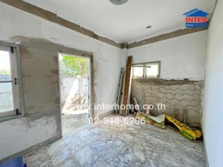 Interior of an unfinished room under renovation with construction materials