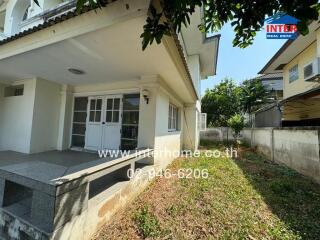 Spacious home exterior with large porch and garden