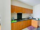 Modern kitchen with wooden cabinets and granite countertop