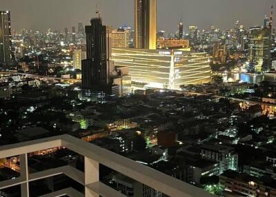 Stunning night view of the city skyline from a high-rise balcony