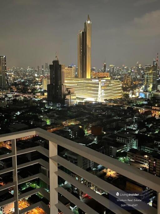 Stunning night view of the city skyline from a high-rise balcony