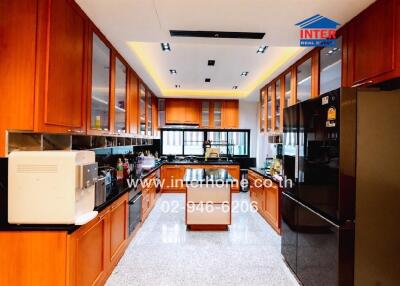 Spacious kitchen with modern appliances and ample cabinetry