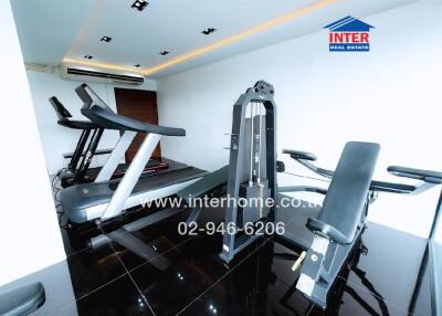 Modern home gym with treadmill and weight training equipment