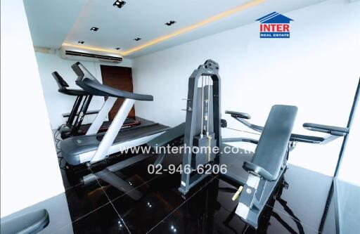 Modern home gym with treadmill and weight training equipment