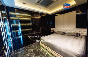 Luxurious bedroom with modern design and ambient lighting
