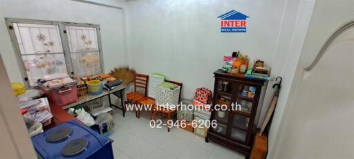 Spacious kitchen with storage cabinets and cooking appliances