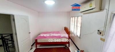 Bright and compact bedroom with air conditioning