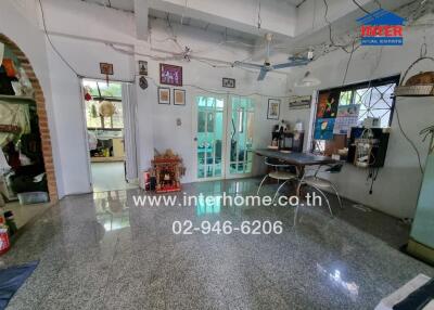 Spacious living room with traditional decor and large tiled floor