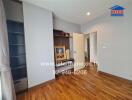 Elegant bedroom with hardwood flooring and built-in storage