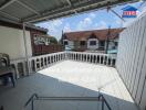 Spacious balcony with urban view and railing