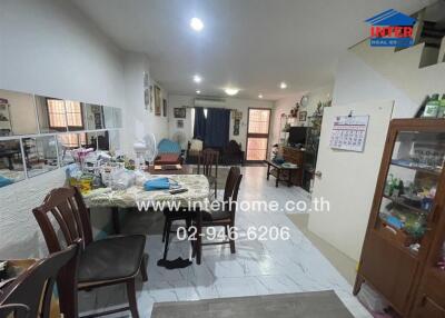 Cluttered kitchen and dining area in a residential home