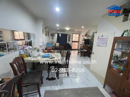 Cluttered kitchen and dining area in a residential home