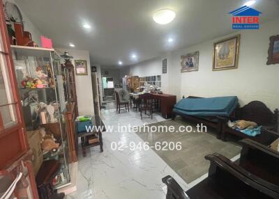 Spacious living room with dining area and tiled flooring