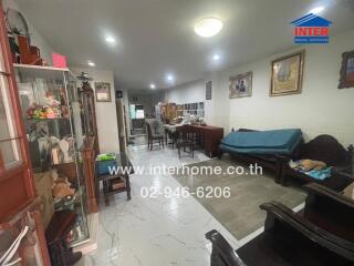 Spacious living room with dining area and tiled flooring