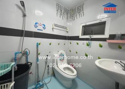 Spacious and well-lit bathroom with modern amenities