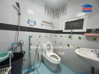 Spacious and well-lit bathroom with modern amenities