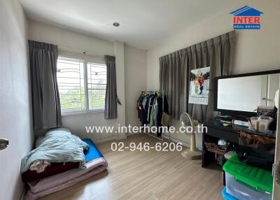 Moderately furnished spacious bedroom with natural lighting