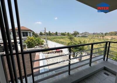 Spacious balcony overlooking green landscape