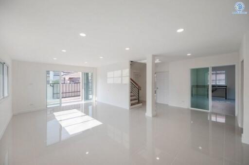 Spacious and bright modern living room with glossy tiled floors