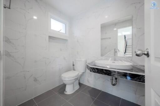 Modern bathroom with marble tiles and elegant fixtures