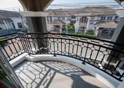 Spacious balcony overlooking residential neighborhood