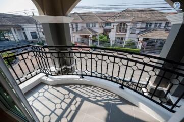 Spacious balcony overlooking residential neighborhood