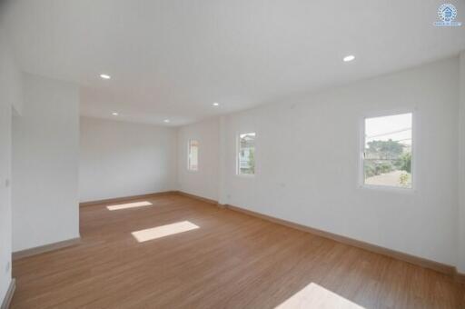 Spacious and bright empty living room with hardwood floors