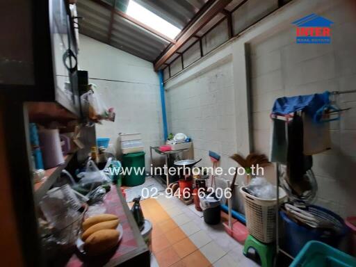 Cluttered utility room in need of organization with visible supplies and equipment