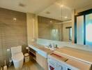 Modern bathroom with integrated laundry area