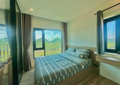 Spacious bedroom with mountain view and modern decor