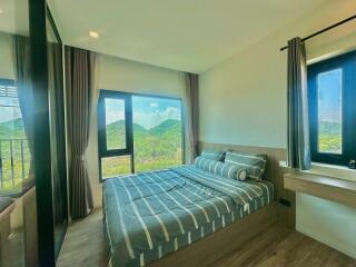 Spacious bedroom with mountain view and modern decor