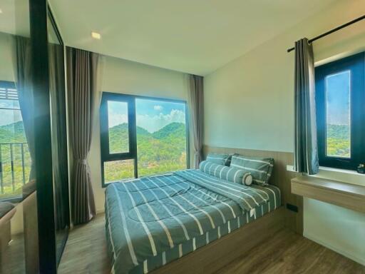 Spacious bedroom with mountain view and modern decor