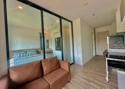 Modern living room with large glass doors and balcony access