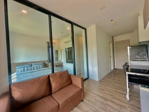 Modern living room with large glass doors and balcony access