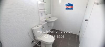 Modern white bathroom interior with toilet and sink