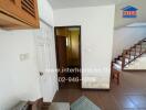 Spacious entryway with staircase and hallway inside a residential house