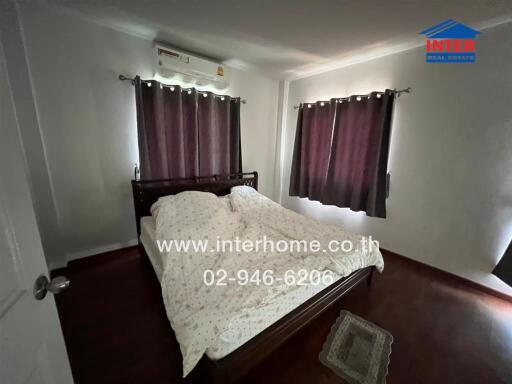 Spacious Bedroom with Large Bed and Air Conditioning