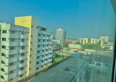 Cityscape view from high-rise apartment window