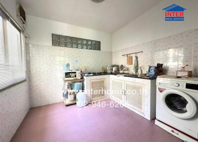 Spacious kitchen with ample storage and modern appliances