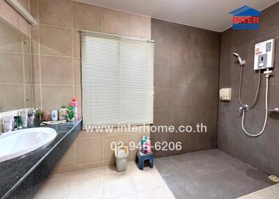 Modern bathroom with shower and countertop basin
