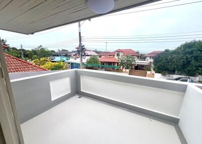 Spacious balcony overlooking residential neighborhood