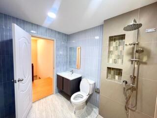 Modern bathroom with blue tiles and shower