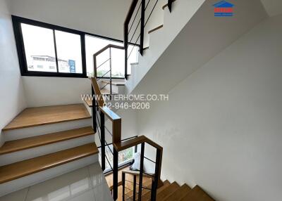 Modern staircase in a residential home with bright natural light