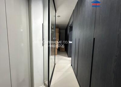 Modern apartment hallway with sleek design and tiled flooring