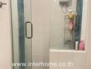 Modern bathroom with glass shower and white tiled walls