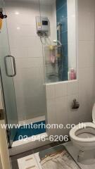 Compact bathroom with shower and modern amenities