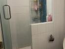 Compact bathroom with shower and modern amenities