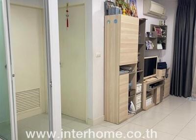 Compact interior hallway with storage solutions and visible rooms in an apartment