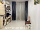 Compact living room with tiled flooring and navy blue curtains