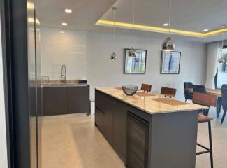 Modern kitchen with central island and dining area